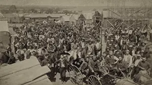 Manifest: Crowd of men, most looking toward the photographer