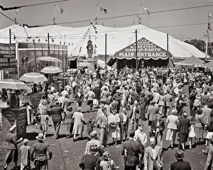 Barkers: Crowd of People in Circus Midway Showing Main