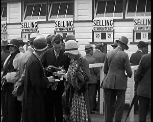 Placing: A Crowd of People Standing Outside A Totaliser/Tote