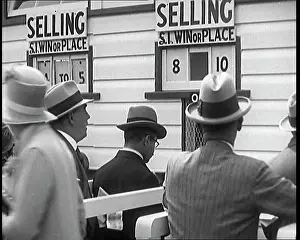 Placing: A Crowd of People Standing Outside A Totaliser/Tote