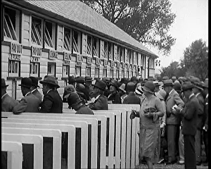 Placing: A Crowd of People Standing Outside A Totaliser/Tote