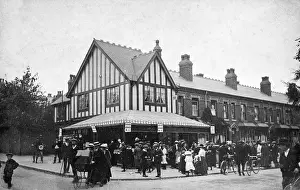 Tuppence: Crowd of people on a street corner, Birmingham