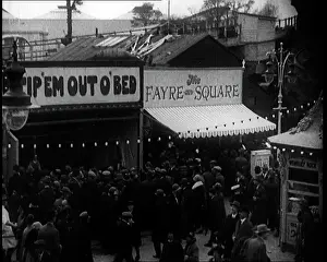 Fayre: Crowds of People Standing Outside the Amusement