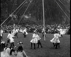 Maypole: Crowds Sitting Outside on the Grass and Watching