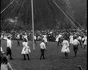 Maypole: Crowds Sitting Outside on the Grass and Watching