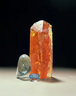 Topaz: Crystal, carving and treated blue topaz