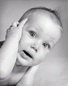 Perplexed: Curious Inquisitive Baby Questioning Facial Expression