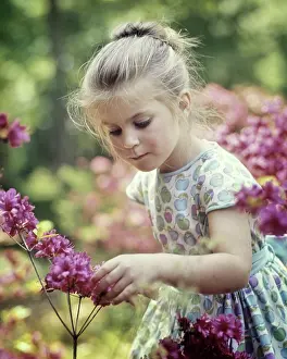 Azalea: Curious Pretty Little Girl Bending Touching Spring