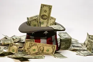 Tossed: CURRENCY AND UNCLE SAM HAT
