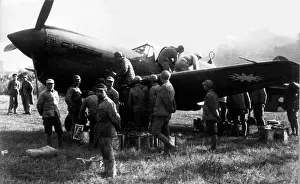 Secondflight: Curtiss P-40B being manually refuelled of AVG