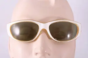 Lenses: Curved front white plastic frame sunglasses