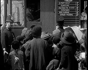 Ordering: Customers Ordering Food From A Soup Kitchen