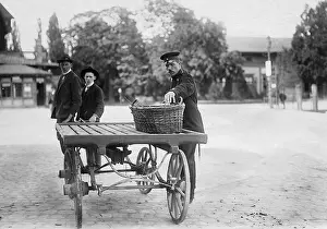Contents: A customs official checks a basket, 1907