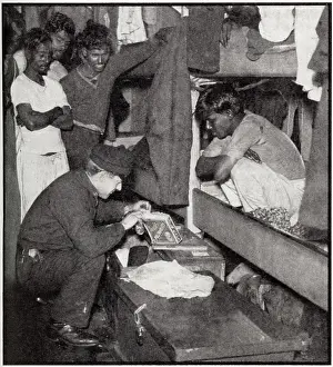 Searching: Customs official searching Lascar crew quarters