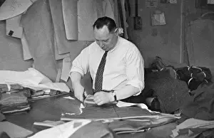 Tailoring: Cutter at work on a garment