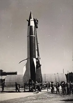 Cradle: At Cuxhaven BAOR scientists prepare a V-2 for launch
