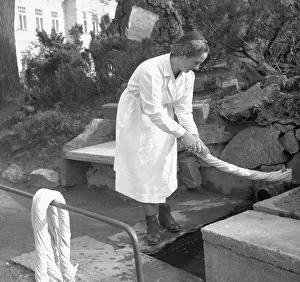 Dolni: Cyechoslovakia, spa Dolni Lipova. Worker washes