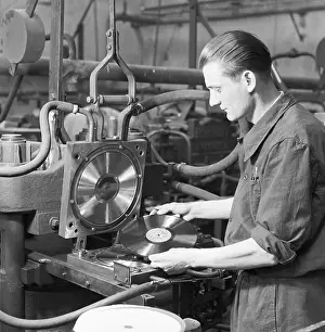 Zavody: Czechoslovakia - 1948. Worker at LP record press