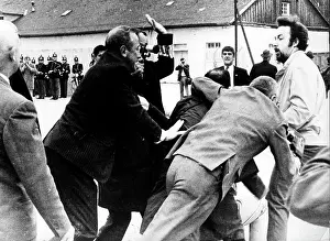 Grapple: Dachau concentration camp ceremony interrupted