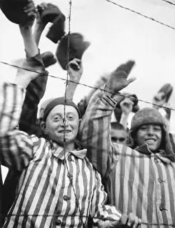 Lcgr1509: Dachau Prisoners wave and cheer the Seventh US Army