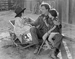 Involve: Dad interacting with two young daughters outside