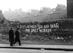 Graffitti: Daily Worker slogan on a wall