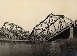 The Kathy Butler Collection: Damaged bridge on a river crossing