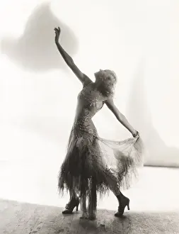 Ov1607: Dancer with arms outstretched against white background