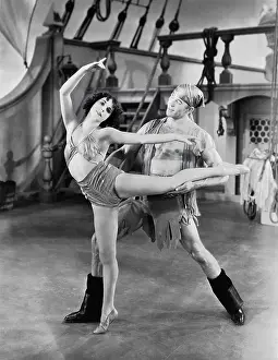Supportive: Dancers in costume on pirate ship