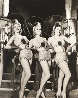 1910s 1940s: Three dancers in fishnet costumes