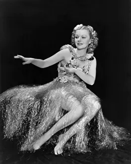 Tinsel: Dancing the hula in a tinsel skirt