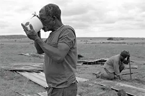 Quenching: Daniel Molefe quenching his thirst after working to