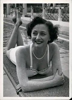 Limelight: Daphne Arthur, actress, relaxing at swimming pool