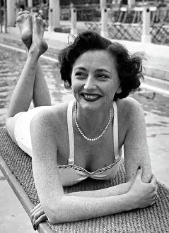 Limelight: Daphne Arthur, actress, relaxing at swimming pool