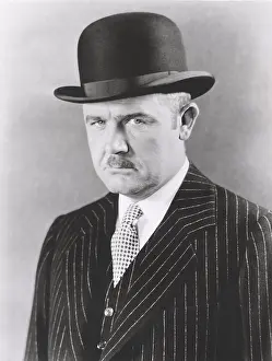 Arrogance: Dapper man in bowler hat