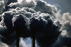 Smokestacks: Dark smoke released into the air from burning ?
