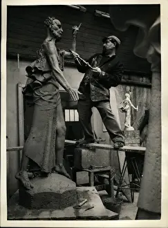 Mcfall: David McFall, sculptor, working on statue, London