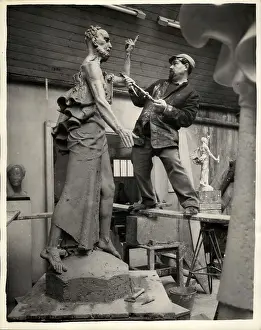 Mcfall: David McFall, sculptor, working on statue, London