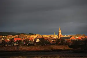 Berwick: Dawn rays of winter sun on town hall clock tower, Berwick
