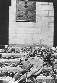 Documentation: The dead body of a German officer lying on the steps of the