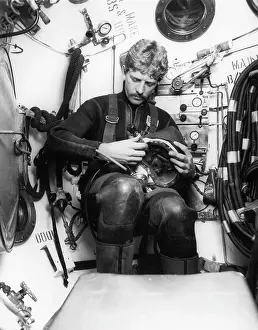 Gauges: Deep sea diver in diving bell, off The Lizard, Cornwall