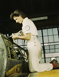 Riveters: Defense worker riveting as part of her training ?