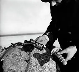Spikes: Defusing a sea mine, 1940