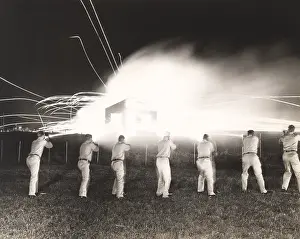 1910s 1940s: A demonstration of night sub-machine gun firing