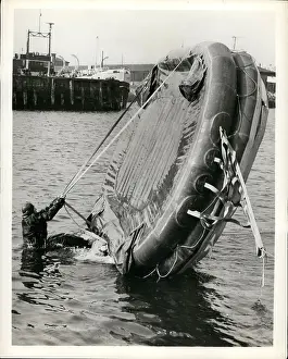 Rafts: Demonstrator shows how to right upturned life raft