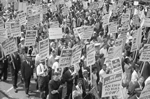 Minority: Demonstrators marching in the street during