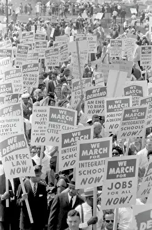 Minority: Demonstrators marching in the street during