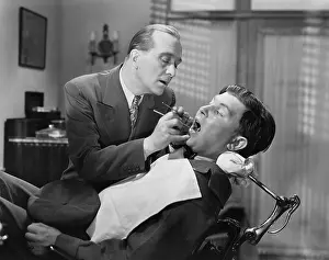 Dentistry: A dentist working on a patient in the chair