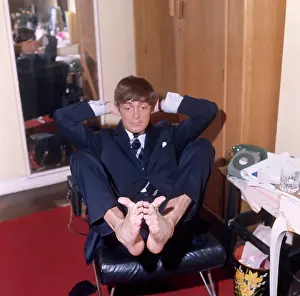 Wastepaper: Derek Nimmo in suit, wiggling toes