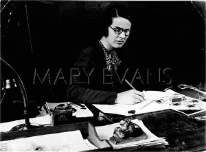 Paperweight: DESIGNER IN HER OFFICE